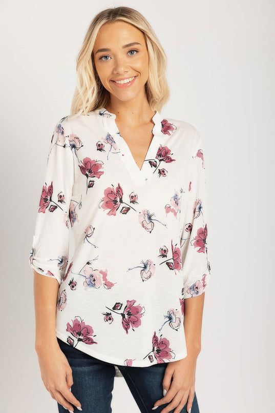 Blouse florale à manches retroussées et demi-patte
