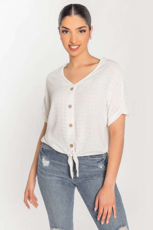 Blouse à carreaux devant noué