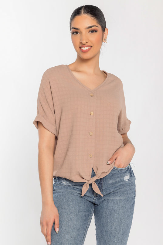 Blouse à carreaux devant noué