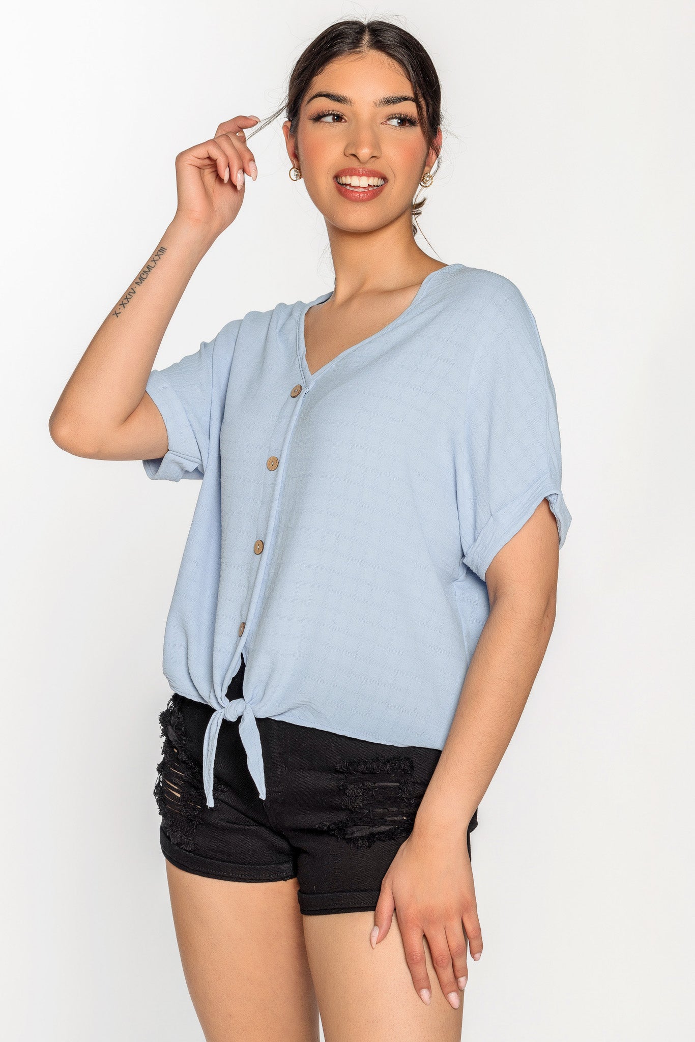 Blouse à carreaux devant noué