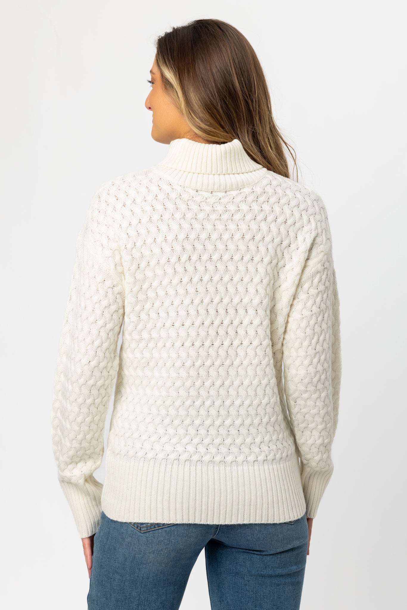 Tricot à col drapé et manches ballon en maille fantaisie